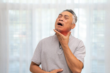 Sick senior man touching neck unwell coughing with sore throat pain,lung...