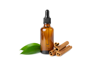 Cinnamon aromatic essential oil and cinnamon sticks isolated on white background. Aromatherapy. Organic cosmetic oil. Spa concept.