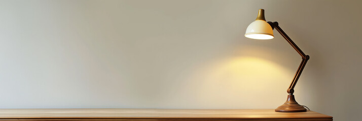 A timeless brass desk lamp casting a warm glow on a wooden table, ideal for studying or working