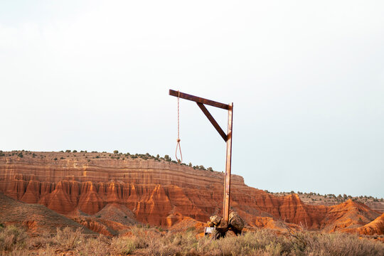 Noose hanging from pole amidst plants at red canyon