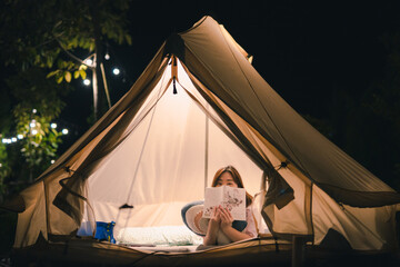 asian woman relax in camping tent on summer vacation