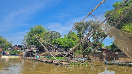 Battambang, cambodia - circa january 2024: fisher boat on the tonle sap river