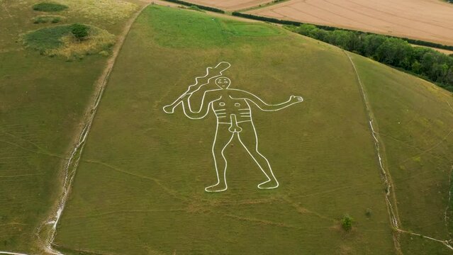 Cerne Abbas Giant chalk hill figure carving outside village of Cerne Abbas, Dorset, England. Probably dates from Mediaeval. 55m length. Video fly in
