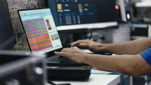 Hands of Security Worker at Video Surveillance Control Point. Male Operator Looking at Monitor, Working in Cybersecurity. Searching for Criminals. Security and People Concept