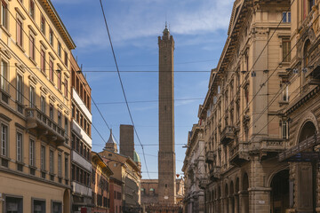 The Asinelli Tower stands tall amidst the historic urban landscape of Bologna, captured between...