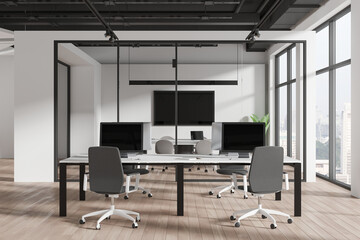 Modern workspace interior with armchairs and pc monitors, panoramic window