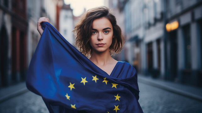 Woman holds the European Union flag in her hand. EU flag at a demonstration for EU accession