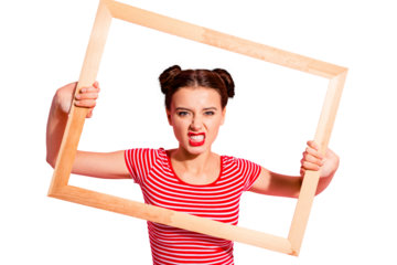 Portrait of her she nice-looking cute charming attractive lovely bossy selfish girl in striped t-shirt holding in hands wooden frame trying to break rules borders isolated over pink pastel background