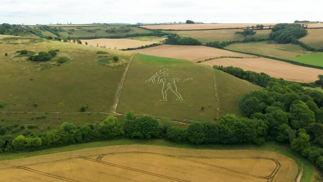 Cerne Abbas Giant chalk hill figure carving outside village of Cerne Abbas, Dorset, England. Probably dates from Mediaeval. 55m length. Video fly in
