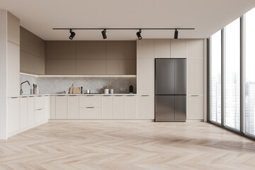 A sleek modern kitchen interior with a herringbone floor, beige cabinetry, and daylight coming from large windows. 3D Rendering