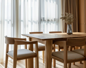 Obraz premium A wooden dining table with six chairs around it and a vase of flowers on it