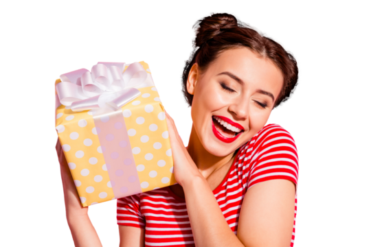 Close-up portrait of her she nice cute charming attractive glamorous winsome lovely content cheerful cheery girl in casual striped t-shirt holding in hands new gift isolated on pink pastel background