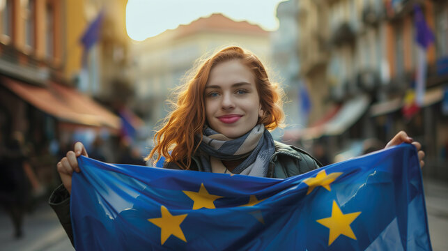 Woman holds the European Union flag in her hand. EU flag at a demonstration for EU accession