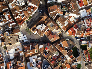 Overhead view of the curved streets and rooftops in Ojen, revealing the intricate layout of this...