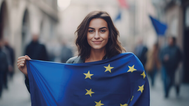 Woman holds the European Union flag in her hand. EU flag at a demonstration for EU accession