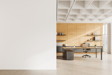 Modern office interior with work desk and laptop, panoramic window. Mock up wall