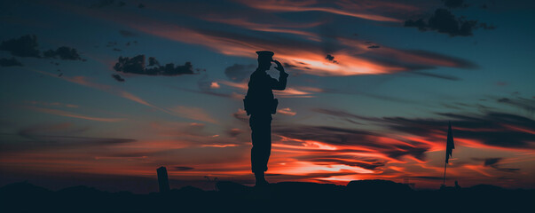 Soldier in Silhouette Paying Homage at Sunset on Memorial Day