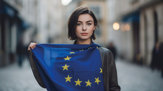 Woman holds the European Union flag in her hand. EU flag at a demonstration for EU accession