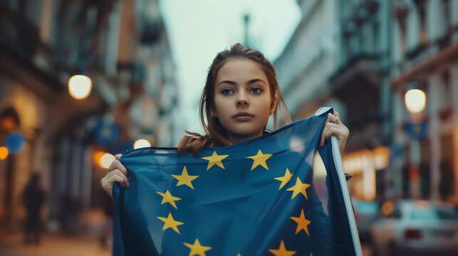 Woman holds the European Union flag in her hand. EU flag at a demonstration for EU accession