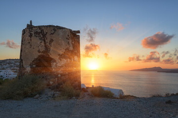 Fantastic view of Santorini sunset, scenic seascape with white architecture, cliffs, colored sky...