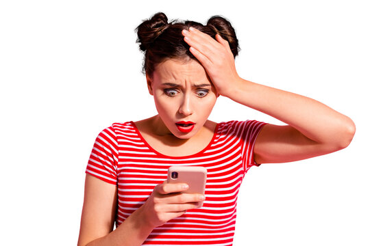 Close-up portrait of her she nice cute charming attractive lovely winsome magnificent stunned girl wearing striped t-shirt holding in hand gadget browsing news isolated on pink pastel background