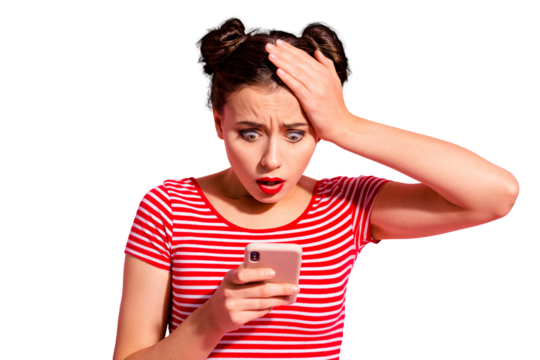 Close-up portrait of her she nice cute charming attractive lovely winsome magnificent stunned girl wearing striped t-shirt holding in hand gadget browsing news isolated on pink pastel background