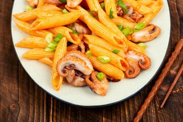 Macaroni with octopus pieces.
