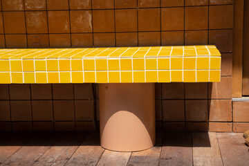 Yellow tiled seating For people to sit and relax in front of shops or cafe.