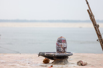 Lord shiva shivling near river ganges in varanasi, India.
