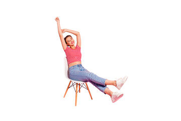 Nice-looking attractive winsome lovely adorable cheerful girl wearing striped tshirt jeans lying on chair resting having fun spare time pleasant isolated over pink pastel background