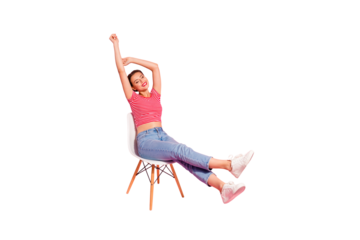 Nice-looking attractive winsome lovely adorable cheerful girl wearing striped tshirt jeans lying on chair resting having fun spare time pleasant isolated over pink pastel background