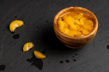 ripe small slices of tangerines in sweet syrup