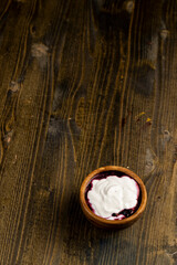 fresh creamy yogurt with berries and blueberry jam