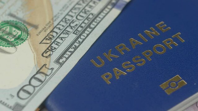 One hundred dollar bills, USA currency. Assistance to Ukrainian refugees. Cash payment to people in need. Concept of poverty savings money or counting budget and unemployment