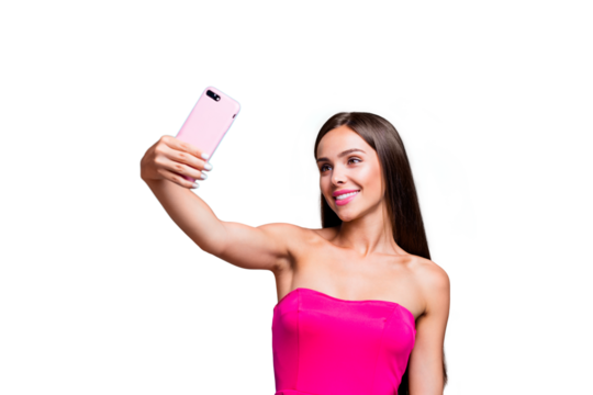 Young straight-haired sweet tender brunette smiling girl with long hair, wearing pink top, making selfie on smartphone. Isolated over bright vivid turquoise teal background