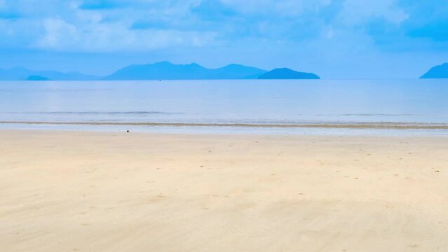 Nature of the beach and sea Summer with sunshine, sandy beaches, clear blue waters sparkling against the blue sky. On an island with good ecology and environment Background for summer vacation 