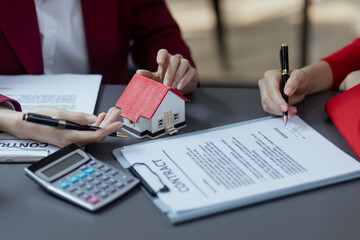 Businesswoman working with housing project to buy and real estate sales. 