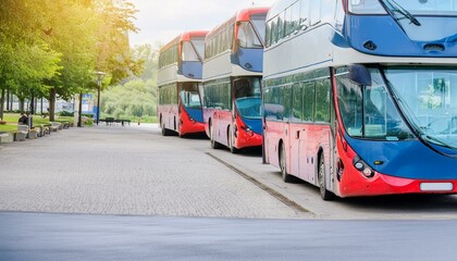 Red double decker buses are parked - obrazy, fototapety, plakaty