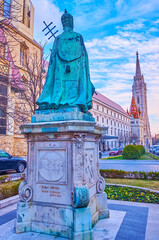 The Pope Innocent XI monument and bell tower of Matthias Church, Budapest, Hungary