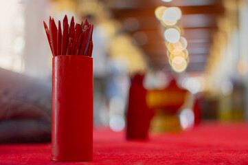 Chinese red bamboo fortune sticks with numbers, shake for future predict in the temple.