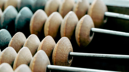 Vintage abacus or abacus on wooden background