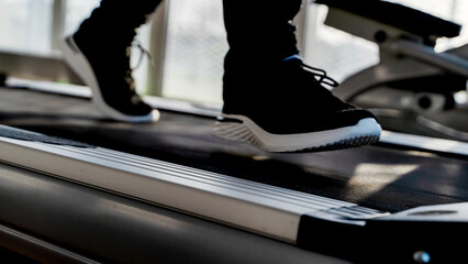 athlete on a treadmill in the gym. Selective Focus