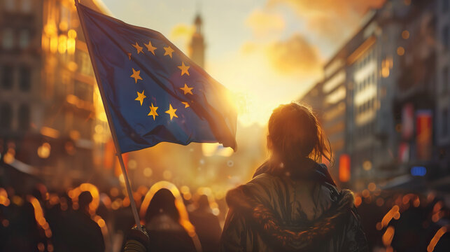 Woman holds the European Union flag in her hand at a demonstration for accession and membership, peace, freedom and democracy. Joining the EU.