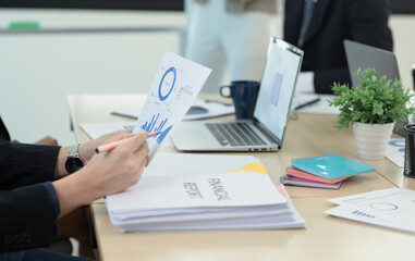 Business hands working together with analysis report chart in office.