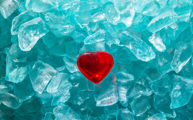 Glass pieces close up found in the sea with shape of red heart glass