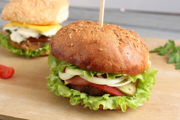 Delicious vegetarian burgers served on table, closeup
