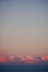 Minimalistic sunset sky landscape with clouds and space for text.