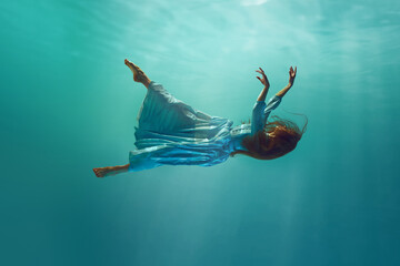 Ethereal depiction of female figure submerged in water, dressed in flowing, light dress. Diving into mystery. Concept of surrealism, beauty, mystery and fantasy, freedom