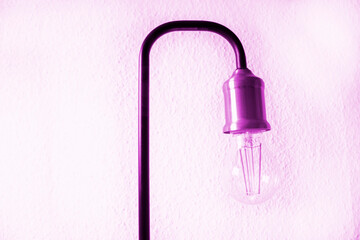 A light bulb on a light-coloured background. Electricity in every house