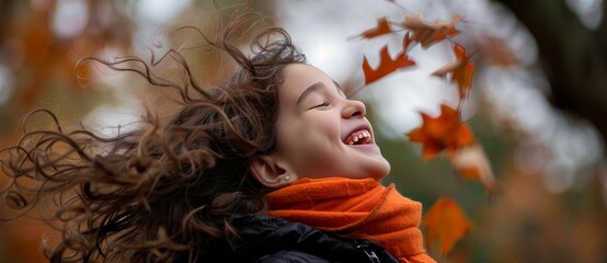 autumn portrait of a joyful little girl